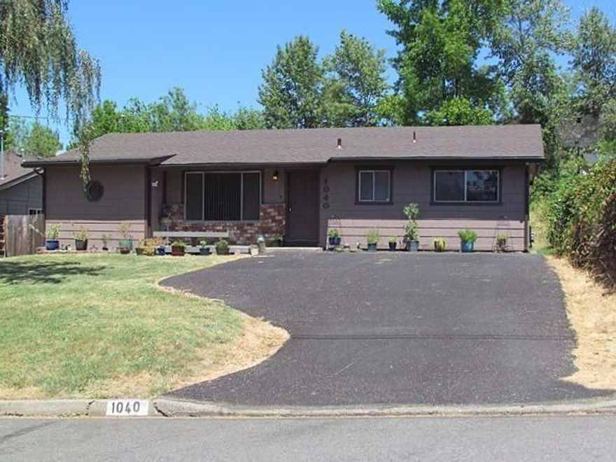 This home has it all; ready to move in and priced to sell. Located in a very nice neighborhood and close to Dist. 7 schools and shopping. With 4 bedrooms, living room, a family room, and a very large fenced-in back yard, there is plenty of space here. The property sits on .25 acre lot. In addition there is a separate, nice size utility room which has the washer, dryer and new hot water heater and can also be used for an office, hobby room or extra storage. Recent updates to the home include new roof, rain gutters, exterior paint, asphalt driveway, 2 natural gas wall heaters, thermostats, all new faucets. New flooring in kitchen, bathrooms, family room and laundry room. New stove/oven, new dishwasher, new refrigerator, new garbage disposal. New vertical window blinds in living room and much more. Move right in and begin enjoying your new home. On Grants Pass Irrigation Dist. Call for your showing today. Comes with 1 year home warranty.