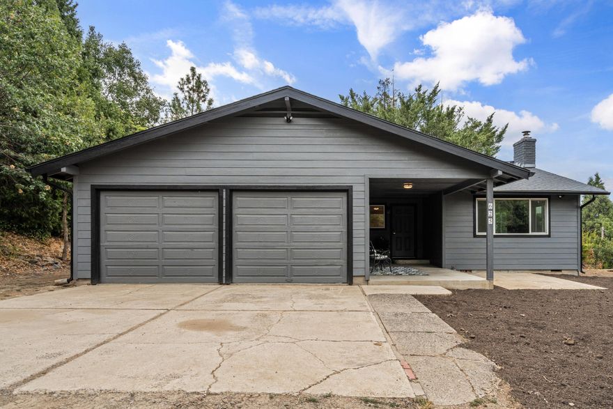 Beautifully remodeled single-level home on a spacious ½ acre in Southern Oregon with sweeping views! Nearly everything is new—windows, doors, siding, paint, flooring, lighting, kitchen, and baths—making this home truly move-in ready. The modern kitchen features fresh cabinets, countertops, appliances, and fixtures, while updated baths bring comfort and style. Enjoy the privacy of a large lot with room to garden, play, or expand—plus potential for a lot split. With a newer roof, new hot water heater, and countless upgrades inside and out, this home offers peace of mind and a wonderful setting to relax and entertain. Plus room for R.V. parking!
