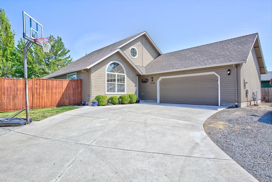 This beautiful home welcomes you in with a vaulted ceilings and large windows. The kitchen features a center island, pantry, granite countertops & new Grey scraped oak laminate flooring in the kitchen, hallway & living room. The bedroom suite has coffered ceiling & walk-in closet. Ensuite bath has double sinks & corner shower. Large upstairs loft could be a 4th bedroom/bonus/office w/storage. The backyard has a covered patio, raised garden beds, custom deck for the above ground pool & custom dog house. The 2-car garage is oversized with room for a shop or toys and RV parking plus additional paved space to park additional vehicles.