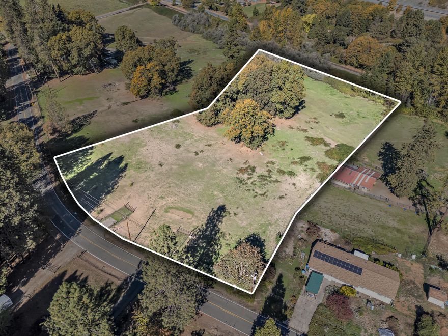 Discover the perfect setting for your dream home on 3.49 acres of flat, usable land just south of Grants Pass. This picturesque property is dotted with majestic oak trees and offers a peaceful, park-like setting near Pierce Riffle County Park and the beautiful Rogue River. Zoned RR-1, this parcel provides flexibility for rural residential living while still being conveniently close to town. A strong-producing well, last tested at 16 gallons per minute, along with septic approval, adds excellent value and peace of mind. A rare opportunity to own a piece of Southern Oregon's natural beauty—ready for your vision to take shape. The neighboring 3.47-acre parcel (4402 Averill MLS #220211326) is also available for sale. Please inquire with listing agent for details.