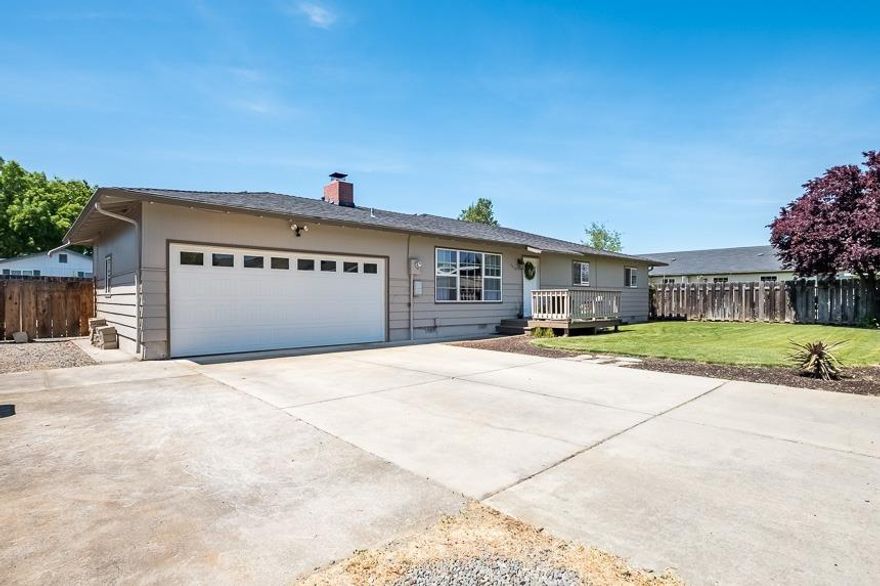 4 beds, 2 baths. RV parking, and a fenced backyard in the Griffin Creek school district. This house has it all! The Living room is open to the kitchen, with plentiful natural light and a fireplace. The Kitchen has been updated with granite counter tops, refinished cabinets and tile back splash. The hall bath has a dual sink vanity and a tub/shower. The master bathroom features a private tile shower. There is hardwood flooring under the carpets. The slider from the living room opens to the newly landscaped back yard with a sprinkler system. New furnace, water heater and garage door were recently installed. Schedule a tour today!