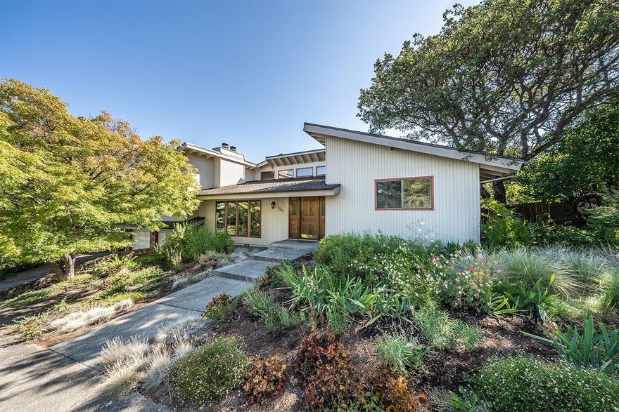 Amazing Mid-Century Modern home in a quiet, convenient East Medford neighborhood. Just around the corner from St. Mary's, RR Medical Center, shopping and more! Large, corner lot with 3 bed, 3.5 baths plus a bonus room or 4th bedroom. Great split bedroom floorplan, multiple living areas featuring built-in fireplaces, shelving, cabinetry and vaulted and beamed ceilings throughout. Convenient kitchen with a large center island, granite countertops, tile floors, eating bar and breakfast nook. Master suite with vaulted ceilings and attached his and hers ensuites. Light and bright finished basement with a huge laundry room, work area, storage room with built-in cabinets and backyard access. Mature, easy care landscaping, expansive backyard deck, raised planting beds, oversized 2-car garage with a storage closet and space for RV parking.