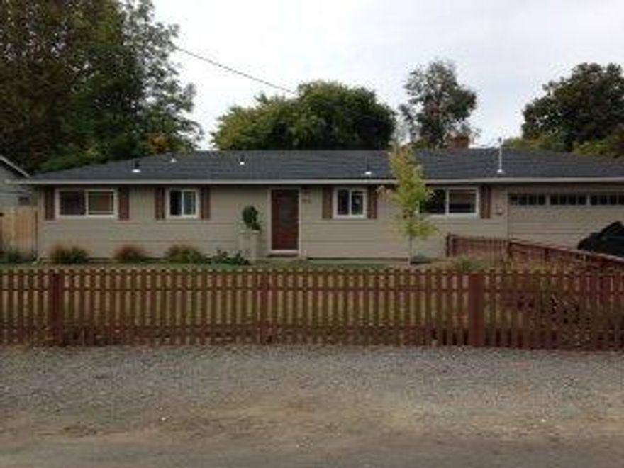 Absolutely a charming place to call home. Fun, cozy, & homey, this family home has been tastefully updated from top to bottom. New Hickory wood floors in the living room & hall, tile floors with tile inlay design in kitchen, dining, foyer & bathroom. New bedroom carpet & lighting. The kitchen features new countertops, cabinet doors, sink, dishwasher & tile backsplash with under cabinet lights. New double paned vinyl windows, siding, exterior paint, gutters and a brand new roof & large covered back patio. Landscaping includes fencing, trees, grasses, and drip lines front and back. All on a huge .26 acre lot. Tons of room to do whatever you desire.