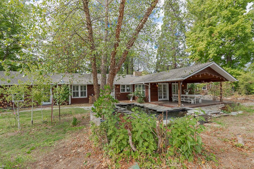 Stunning Single-Level East Medford Home on a Huge .60 Acre Lot! Beautiful Setting amongst a Towering Sequoia & Mature Landscaping. Home offers Both Living & Family Rooms, separated by a Dual-Sided Fireplace! Lovely Kitchen with Maple Cabinets, Spacious Pantry & Stainless Appliances. Awesome Sunroom with Dual French Doors takes you out onto the Amazing Covered Rear Deck; perfect for Outdoor Living! Master Bedroom offers Vaulted Ceilings, Dual Vanities, Spacious Walk-in Closet, & Private Gas Fireplace. Large Utility Room with Cabinetry, & Superb Guest Bath with ADA Compliant Tub. Custom Quality Finish Details & Oak Floors throughout Validate the Care & Comfort this Home presents. Attractive Cedar Siding, Paved Circular Drive, Storage Shed, Two-Car Garage & RV Parking! Awesome Water Feature, Numerous Paths & Sitting Areas, Lovely Landscaping. Ideally Located Minutes to Parks, Asante Medical Center, Rogue Valley Country Club, & more! This is One-of-a-Kind! A Very Special Home & Property.