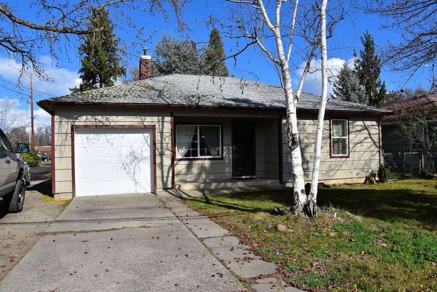 A Clean, Move-in ready 3 bedroom Single Story home that offers Beautiful simulated hardwood flooring and 4 1/2'' baseboards throughout the home. Double paned vinyl windows. Front Living Room w/ white painted brick Fireplace with mantle, crown molding and Mitsubishi air system. Dining Room with sliding door out to backyard. Kitchen has white painted cabinets, Formica counters, Range/Oven, window over sink. Remodeled full bathroom with Granite counter vanity and tiled floor. Crown molding in 2 of the bedrooms. Large back yard for fun and entertaining. Nice newer shed for extra storage/tools. 1 car garage with newer door.  This home is conveniently located close to schools and shopping.