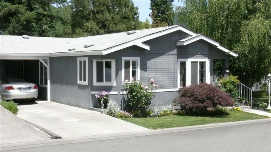 Great floor plan in this beautiful 1848 sq ft manufactured home located in the Highland Heights Estates Mobile Home Park. There is a large open living/dining/family room, spacious kitchen and the two master bedrooms each has their own bathroom. Additional space includes a workshop off the carport, attached storage room, and an attached office. Amenities included vaulted ceiling,plant shelving,two skylights,a gas fireplace,heat pump central heating and air,and a multitude of windows to bring plenty of sunlight into this well maintained home. There is a 2 car carport and additional room to park in the driveway. Wrap around back deck provides plenty of room for outdoor entertainment, dining, and relaxing. A 3rd bedroom can be added to the large great since the floor plan was designed for it to have a 3rd bedroom.