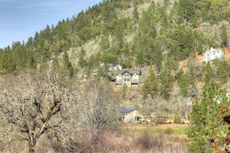 Nestled in the foothills of Shady Cove, a charming community on the banks of the Rogue River, this gorgeous Craftsman awaits. With incredible views from nearly every window and ample square footage, this home offers diverse possibilities for a wide range of enjoyment. Family home; vacation retreat or rental; 2 family setup, anything is possible. With 3 bedrooms, 2 master suites, space for a 4th bedroom or office, living rm plus a huge bonus/ game rm, there's tons of space to spread out and enjoy this tranquil mountain setting. As great as this is, it's the beautiful architectural features, soaring ceilings, huge windows, amazing views and abundance of natural light that really set this home apart. Top it off with spacious decks for outdoor entertaining and one can't help but relax and bask in the glory this private valley offers. All of this just minutes from world class salmon, steelhead and trout fishing and only a short drive to Medford. Come see everything this great home offers!