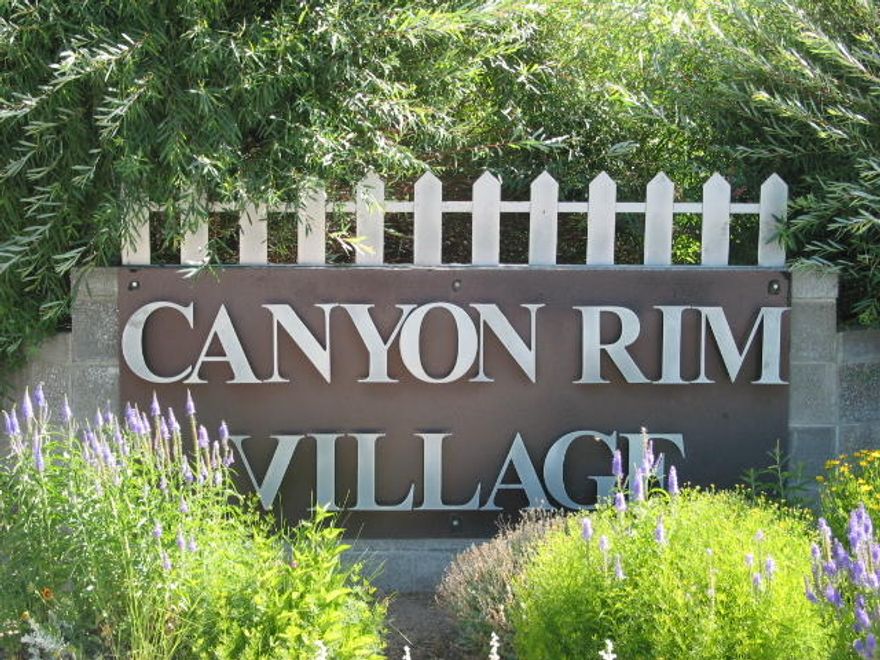 Join a great street of new homes in Redmond's unique and desirable neighborhood of craftsman-style homes, tree-lined streets, and great neighbors in the heart of Redmond! Canyon Rim Village is nearing completion so don't wait! This lot has views to the Dry Canyon across the street from the front--enjoy your morning coffee on your front porch & watch the sunrise! You will be just down the street from 3-ac West Canyon Rim Park (City owned) and paved access to the Dry Canyon Trail which runs thru Redmond. Good access to services, medical, airport & the Bypass. Designs have to meet ARC approval, bring your own builder or Broker can recommend. POF or preapprl must be submitted with offer. New phase, taxes have not yet been assessed. Get your dream  home started so you can enjoy a wonderful Central Oregon summer!