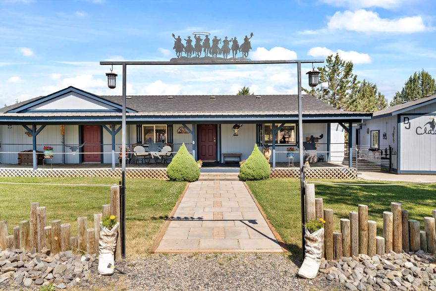 Western flair greets you at this rural setting ready for horses/cows on almost 3 acres. Gated fenced and cross fenced. Barn wood accents throughout this updated 1992 manufactured 3 bedroom, 2 bath, 1404 sf home. Updates include granite counters, updated kitchen, main bath, laminate flooring, HP/AC in 2016, new roof in 2019. Newer 2 stall barn, hay storage, tack room, several fenced pens/pastures and 50' round pen with dustless sand. Multiple sheds and storage outbuildings. Large double detached garage shop with additional storage/shop in back 220 power. Good producing private well and garden area. Enjoy the soothing sounds from large water features/pond from covered front deck or morning coffee while lounging in the enclosed sunroom overlooking 2 small ponds/water features in fenced backyard. Top off your day, relaxing in the hot tub!