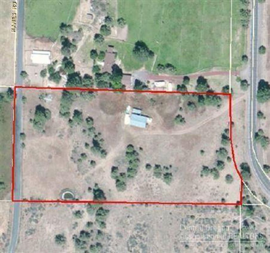 Exceptional rural property set among larger horse ranches in SE Bend. Underground irrigation system installed and functional, very sturdy horse barn, and utilities extended on to the property to minimize future development costs. Pine and Juniper treed building spot located well off the road for privacy.