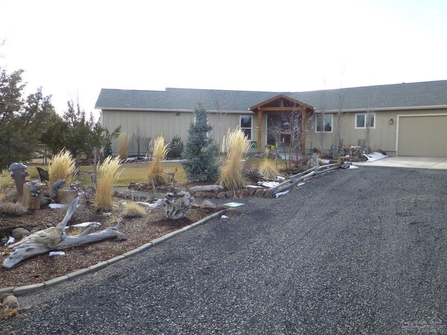 Stunning home on private 10 acre parcel. Home features 2 master suites, solid wood knotty alder doors, all knotty alder trimmed windows and doors, granite counter in kitchen, tile counters and floors in both master bathrooms, new paint inside and out, new carpet, new wood floor in living room. Oversized garage, 36x48 heated shop with 1 overhead door, extensive landscaping, water feature, orchard, raised garden beds, and greenhouse. Must see property.