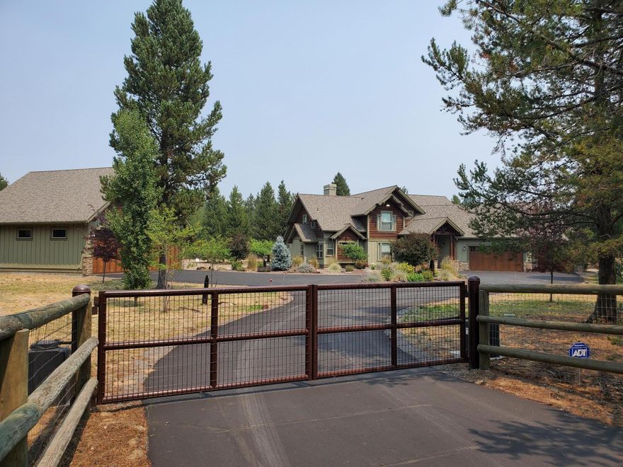 Custom Northwest Lodge Style home in a spectacular setting with lots of privacy.  Private electric gate and circular paved driveway. Primary Room is on the main floor as well as the Office.  Upstairs Game Room with lots of cupboard space and a beautiful deck. Irrigated and Landscaped.  3 car garage with an additional 4 car garage/shop     ( 36 x 36). The shop has an electric heater too!  Minutes away from Deschutes River, Sunriver, Mt Bachelor and multiple golf courses.  Less than 30 minutes to Bend! Quality Craftmanship throughout.  Its a must see! Contact Listing Brokers regarding furnishings.