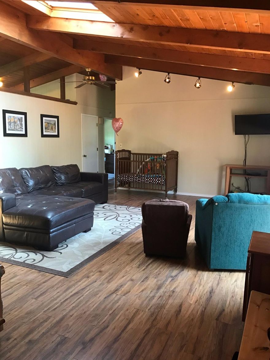 Fantastic location in old East Medford! Open beam ceilings W/tongue-in-groove Knotty Pine. Skylight, ceiling fans, open floor plan, cute front entry, porch, back yard set up w/raised garden beds already producing veggies! Recent updates include, interior & Exterior paint, new kitchen, remodeled bath. Close to schools & parks.