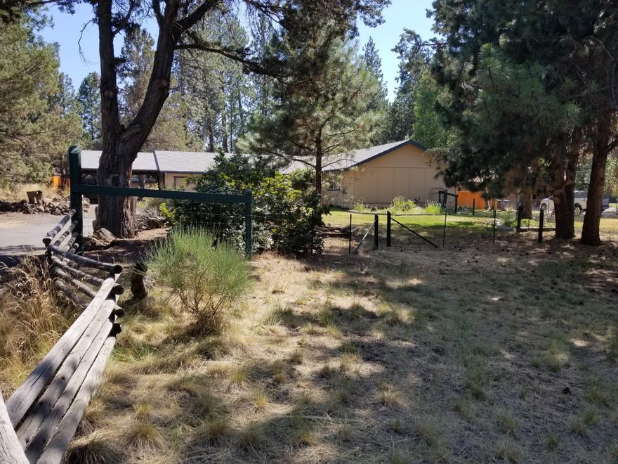 One of the few large .65 acre lots in an established King Forest neighborhood of large lots in the city of Bend. The location has easy access to parks, shopping, schools and to the Old Mill District & Deschutes River. Or keep going on your way to Mt Bachelor and the high lakes. The single level home has covered deck off the back to large yard with easy care landscaping and room to entertain and enjoy the outdoors. Room for parking your boat and/or RV. Attached is a 2 car garage and additional 2 car carport. Out back also includes a storage shed. The interior has cozy living room with wood burning fireplace. The open eat in kitchen has additional walk in pantry for extra storage & large utility room including the newer washer & dryer. New vinyl floor installed in living, kitchen and bedrooms of the home. The bedrooms have nice large closets. This is a must see home.