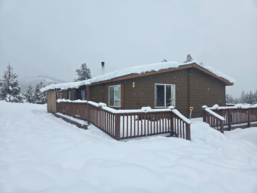 A Blissful Retreat Awaits! Welcome to 22860 Bliss Rd, a stunningly remodeled 3-bed, 2-bath home on 21.93 serene, fully fenced acres. This 1,760 sqft beauty has been professionally updated, blending modern elegance with country charm. Inside, enjoy gorgeous new flooring, fresh paint, stylish fixtures, and a brand-new kitchen with lovely countertops, modern cabinetry, and updated appliances. The refreshed bathrooms offer spa-like comfort, while the open floor plan invites warmth and natural light. Outside, take in breathtaking views and explore the new outbuildings, including a spacious shop and a charming chicken coop. The property is truly a homesteader's dream, featuring full RV hookups and 7 acres of marketable timber. Whether you seek a private retreat, a hobbyist's paradise, or a place to live off the land, this gem has it all. Don't miss out—schedule your tour today!