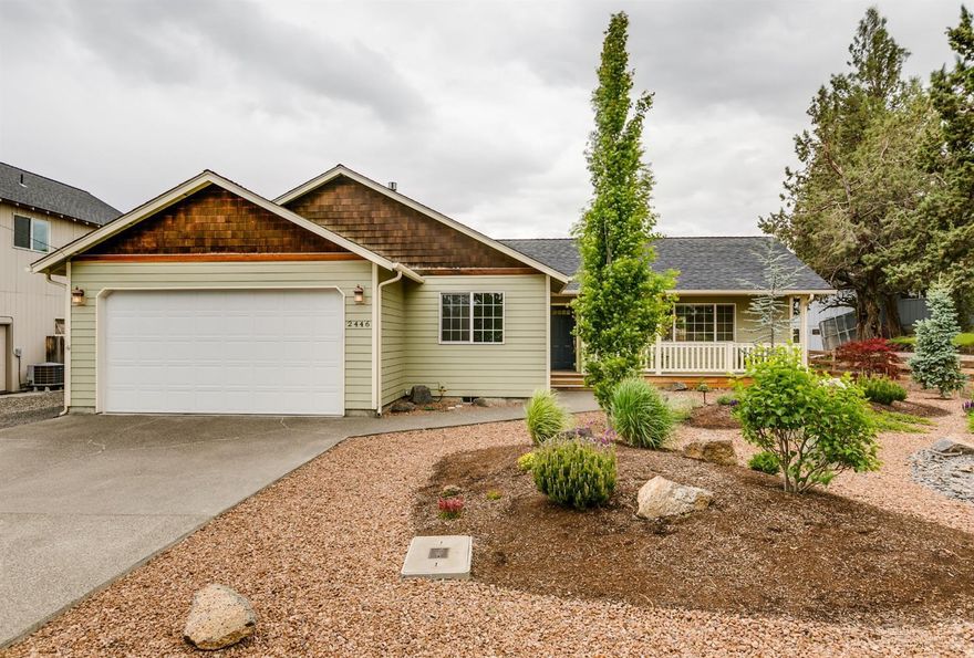 Impeccably maintained home is serene garden setting in SW Redmond! Pride of ownership is apparent throughout this 3 br, 2 bath home. Great room layout w/huge windows bring the beautiful landscaping in. Open kitchen w/central island & lg pantry, plenty of counter space & SS appliances. Corner gas fire place in the living room keep it cozy in the winter. Space to entertain year round w/covered patio just off the dining area. Master Ste offers a lg walk in closet, luxurious bath w/double sinks & walk in shower. New Quartz counters & backsplashes in both baths! Tiled floors & just cleaned carpets, this home is immaculate. Outside you'll find magazine worthy low maintenance landscaping that blooms all season long & irrigation systems in place. Huge back yard w/fruit trees, seating areas & fire pit. Storage shed makes a great work shop or hobby room. Gas forced air heat & A/C too! Adjoining lot also available.