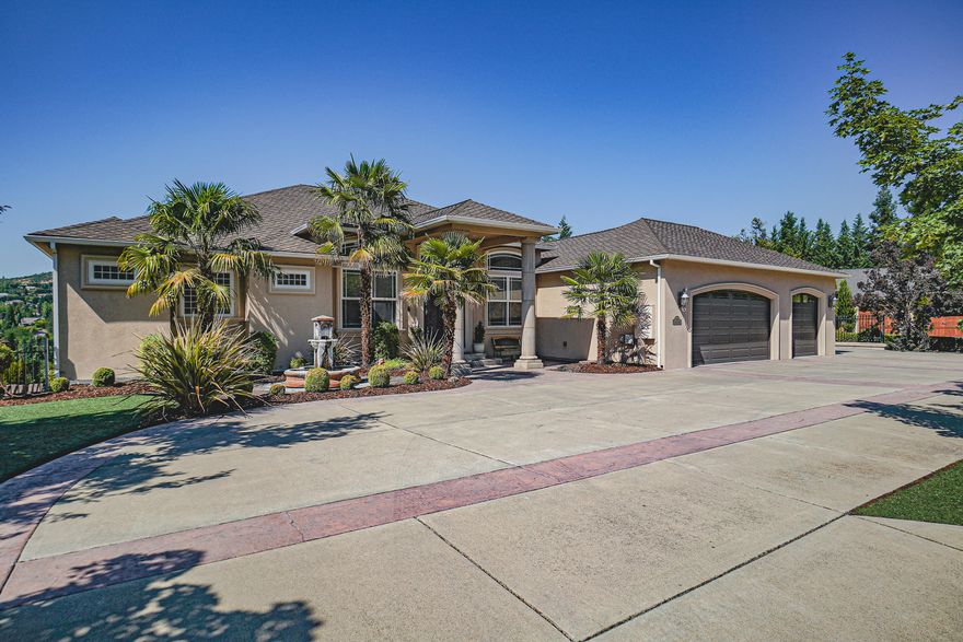 Welcome to paradise! This 4 bedroom/3 bath, 5056 sqft home boasts its high end amenities & gives you the feeling of being in Tuscany from the moment you walk in. This beautiful home features game/theatre room, wet bar, office, large laundry/storage/craft/ exercise room, wine room, 3 gas fireplaces, surround sound/intercom, & Ring security system. Gourmet kitchen is a chef's dream w/ walk in pantry, 5 burner range w/ warming oven, wine fridge, island, large built in fridge/freezer & double wall oven. Covered balcony off living room overlooking Roxy Ann. Main level master has its own private balcony & fireplace. Master bath features walk-in glass block shower for two, jetted soaker tub, dual vanities, heated floors, two walk in closets (one closet is 450 sq ft). Hardwood, tile/marble & carpeting throughout. Additional amenities include Gunite heated pool, hot tub with waterfall, sports court with bball hoop, large covered patio & RV pad with hook-ups. Too many amenities to list all!