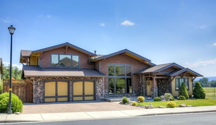 Stunning home in Echoes of the Ponderosa! This 3 bedroom and office, 2.5 bath boasts upgrades that other homes don't! Large, Fabulous main floor master with heated tile, jetted tub, towel warmer, oversized slate shower, gorgeous granite, slate floors and a professionally designed master closet. Soaring ceilings and huge beams in the open living, dining, kitchen area with massive windows and a ceiling height stone fp. Island kitchen with professional Viking SS appliances, pantry, large utility room. Good sized bedrooms, huge bonus room with wet bar and room for a pool table and a media area. Outdoor living is resort-like with a built-in spa, lagoon pool with a gorgeous waterfall feature, outdoor kitchen, firepit, raised beds and more. 3 car garage with built-in professionally installed storage areas. Open space behind and views of the surrounding mountains make this a home you won't want to miss!