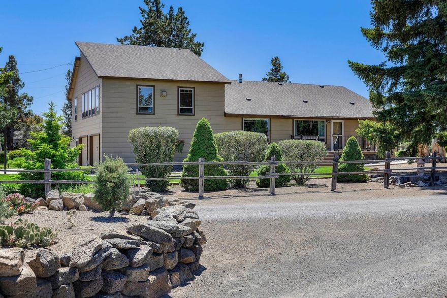 A beautifully renovated farmstead in Northeast Bend offers stunning views of the Cascade mountains. Nestled on 9.42 acres, this property includes lush pastures, well-kept lawns, and thriving gardens with 8 acres of irrigation. Inside, you'll find a spacious kitchen with an eating bar, Silestone countertops, cherry wood cabinets, and stainless steel appliances. The living room and family room feature vaulted ceilings, creating an airy and inviting atmosphere. The main floor includes the primary suite and bath with a large walk-in closet, alongside a second bedroom and bathroom. Above the garage, an expansive family room area boasts a propane fireplace and wet bar, perfect for entertaining. Outdoor amenities include two shops—one with three garage bays—a barn, and a pumphouse/storage. Envision a peaceful retreat surrounded by nature's beauty, this farmstead in Northeast Bend offers it all!