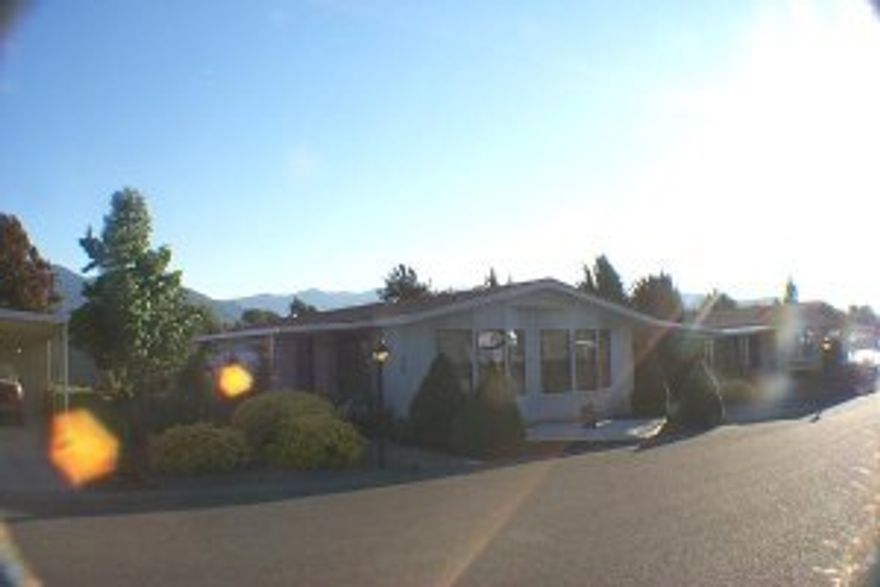 In park must have current DMV license to show or sell - Great retirement home in very desirablepark with clubhouse, pool & many other amenities - Nice useable floor plan - vaulted ceilings - New roof - Good size attached storage bldg or hobby shop - Covered patio - Large back yard for garden or ? - Owner will carry 1st w/10k down.