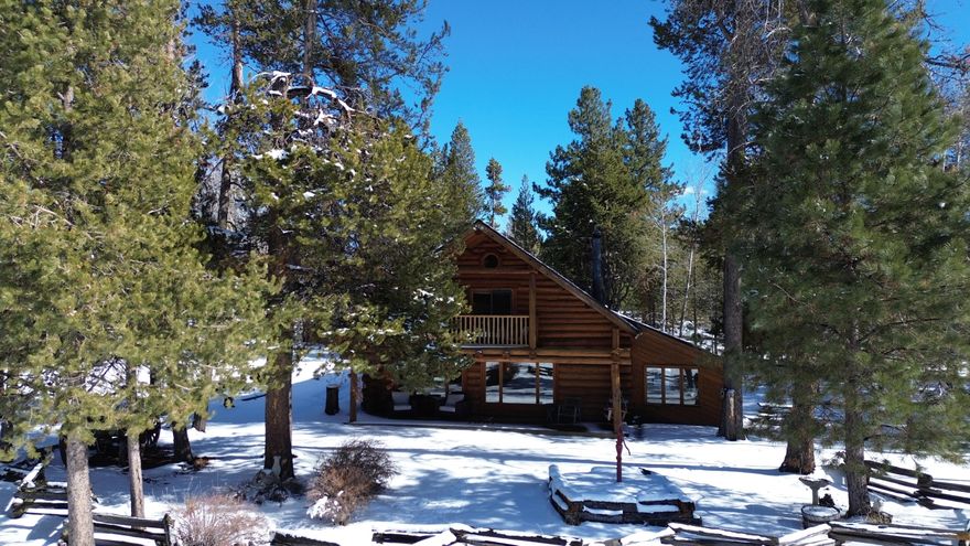 NOW AVAILABLE Hand scribed Douglas Fir log home located outside of Bend Oregon. The property encompasses 16 acres over four separate tax lots - one lot buildable. Prime river front and complete Cascade Mountain views. The accommodations include an elegant custom-built 2,245sqft log home featuring 3-bed 2-baths & office space. The home is appointed with a large great room perfect for entertaining, solarium with its own hot tub, a lava rock backed fireplace and a large kitchen. The grounds include a 52-ft-long RV bay, large 2 car garage, landscaped gardens, and private woodland w/ river frontage. Five minutes to Sunriver Lodge, 25 minutes to Bend & Mt. Batchelor ski resort. Seller will entertain a seller financing option.