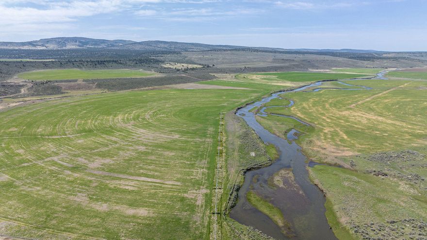 The Giorgi Ranch features 2,545± total deeded acres, with 766± acres of irrigated hay & pasture, & almost 1,800± acres of rangeland, rimrocks, & big game hunting grounds. An owner-operator can run this efficient ranch as a great hay farm, cattle operation, or a combination of both. This ranch is well equipped with an excellent infrastructure & includes 3 homes, 1 bunkhouse, a sizeable shop, horse barn, corrals, cattle scales, squeeze chute, & leadup. 8 irrigation pivots, multiple wheel lines, & gated pipe round out the major systems on this well-balanced ranch. The current owner has also had excellent big game hunting success, harvesting several nice mule deer bucks & large Rocky Mountain bull elk over the past 20± years. With 3 landowner preference tags for buck mule deer & bull Rocky Mountain elk with access to thousands of acres of BLM, you're sure to scratch your big game hunting itch here. Located 1 hour from Prineville, this excellent ranch is surrounded by other large ranches.