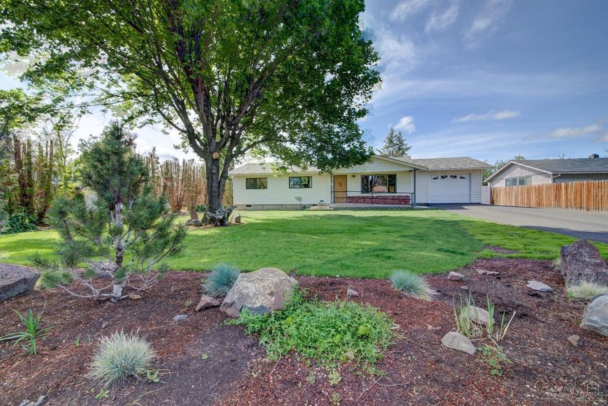 Beautiful updated home in the heart of Redmond! This home is set on a park like, manicured, and fenced .25 acre lot! Home boasts new flooring, cozy upgraded kitchen with granite counter tops and charming gas fireplace! The doorways are finished with new molding and wide enough for handicap accessibility, as well as an accommodating handicap bathroom. The exterior has newer siding and paint with gated alley access and RV parking. Walking distance to Redmond High and the Dry Canyon Trail!