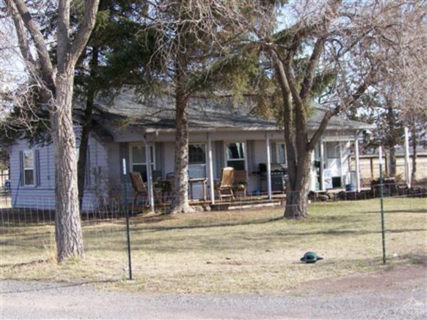 A great property with many possibilities, you can live here in the house nestled in the trees with outbuildings for your extra things or friends. Rent the house, rental income in the past has been $850 per month. Or develop the property for a commercial use. This is a fine location to develop now or in the future, very visible from Hwy 97 by pass. Home depot next door. Great commercial property with some rental income at this price is hard to find.