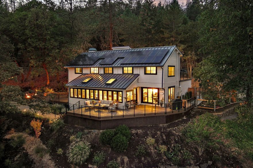 Prepare to be wowed by the breathtaking panoramic views from every corner of this stunning home, nestled in a serene and sought-after location just outside Jacksonville in Wine Country Heaven. Combining modern luxury & natural beauty, this property offers the perfect balance of tranquility & convenience. Close to Rellik and Hummingbird Wineries! Expansive windows & glass doors invite the outdoors in, creating bright, spacious living areas that flow seamlessly to the outdoors for entertaining & relaxing. The spacious chef's kitchen features a massive quartz counter island for meal prep & dining. The primary suite is a true retreat & the bathroom boasts the highest-end, European-inspired plumbing & design, offering a spa-like experience. The beautifully designed xeriscaped native plant landscape by Sager Design, providing a peaceful space, while taking in those spectacular views. Plus, a newly built pool deck adds the perfect touch for sun soaked relaxation.