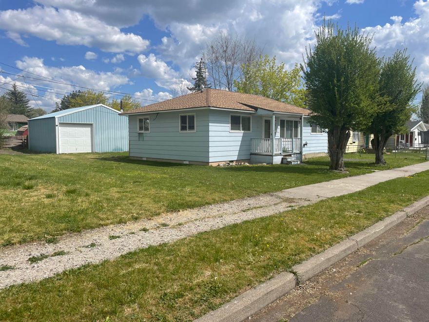 Starter or investment ready with bonus shop.  We can't wait to see how this sweet little well-built house transitions for the next generation.   Very open kitchen and living space is flanked on both sides by a three bedroom one bath layout.   Breakfast bar and kitchen open onto a rear porch and into a level fenced yard with........get this, a 24 X 24 perfect concrete insulated slab shop/garage and bonus utility shed.  New roof and upgraded double pane vinyl windows, plus hidden hardwood floors add value to this little gem.  Located on a short dead-end street just a stone's throw from Freddy's, Crater Lake Parkway and South Sixth St.