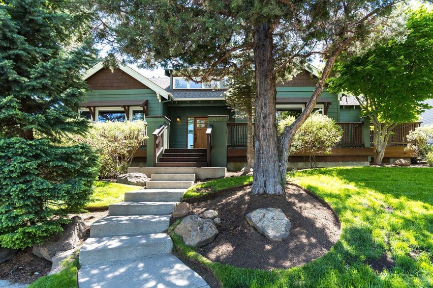 Beautiful craftsman style home with nearly all main level living. 3 bedrooms with 2 full baths on main level. Large bonus room is upstairs over the oversized double car garage. Hardwood floors throughout entry, living, kitchen and dining area. Gas fireplace with slate surround. Expansive exposed beams in the vaulted ceilings in the living room. Master suite with vaulted ceilings and a soaking tub and separate shower. Extra large fenced corner lot with mature landscaping. Large front deck with city views.