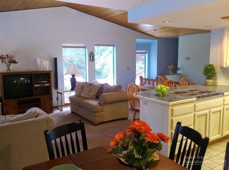 Relax in the private hot tub after a day of play. This two-story turn-key 3 bed/2.5 bath condo overlooks the 9th fairway of the Woodlands Golf Course. North-end location provides easy access to your outdoor adventures. Attached single car garage. Community pool.