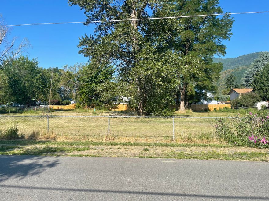 MFR-20 Open to Cash Offers. 
In the heart of Rogue River. Zoned R-2 Multi-Family. Half of the original .55 Acre. Flat lot with all utilities at the street. NORTH-Parcel #1 is 11,865 SF. More than ample size for a new home or duplex. GPID irrigation water rights. Lovely quiet location. SEE DOCUMENTS RE-PLAT recorded 2-3-22. Seller/Owner is licensed broker. Buyer to perform due diligence for permitted use.