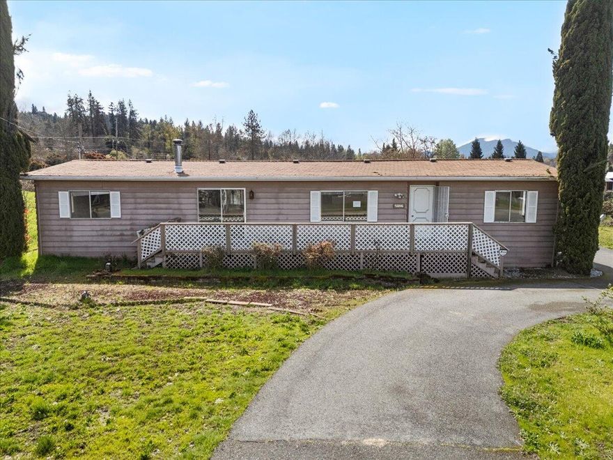 Two homes on one lot! If multiple households need to be close for CHEAP this may be your ticket! Or consider possible re- development opportunities on this nearly one half acre zoned R-1-8. A second 784SF single wide built in 1975 is also on the property. Possible investor opportunity. Large enclosed porch. Circular pull through driveway. Cash only. See Instructions.