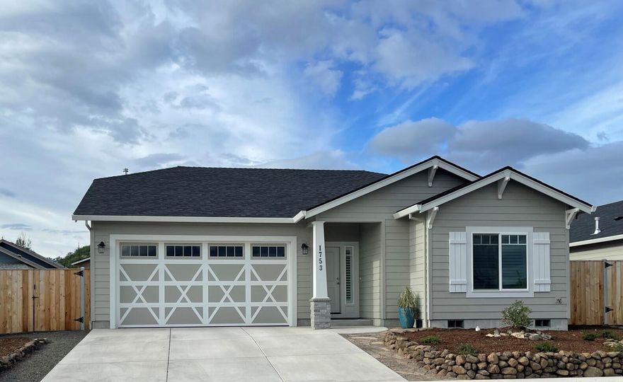 This immaculate and well kept 1546 sq. foot home in East Medford was built in 2020. It features 3 bedrooms and 2 bathrooms in a split floor plan with vaulted ceilings, kitchen with quartz counters, custom alder & birch cabinets and high-end fixtures. The gas stone fireplace gives a warm touch to the open living area. The large main bedroom showcases vaulted ceilings with a large walk in closet, on suite with double sinks and a walk in shower.  Large fenced back yard rounds out this move in ready home!