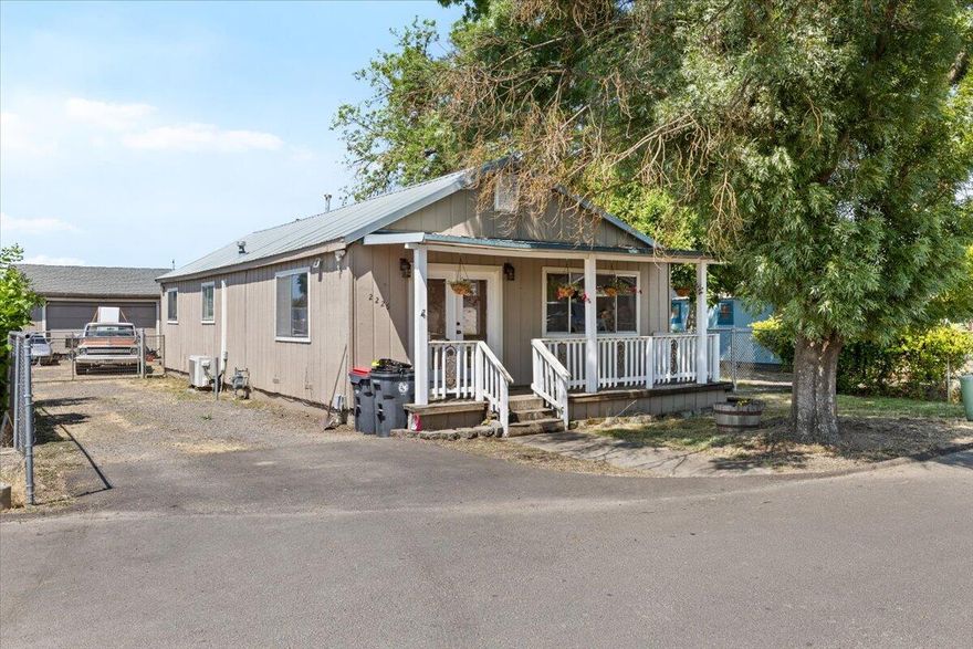 Discover this charming home with a spacious living room, dining area, and fully-equipped kitchen. It includes a modern bathroom with tile floors, indoor laundry room.  Check out the large, gated RV parking area, covered patio, storage sheds, and ample privacy. Plus, plus, plus enjoy the 20' X 40' shop -10 ceilings. A fantastic buy!