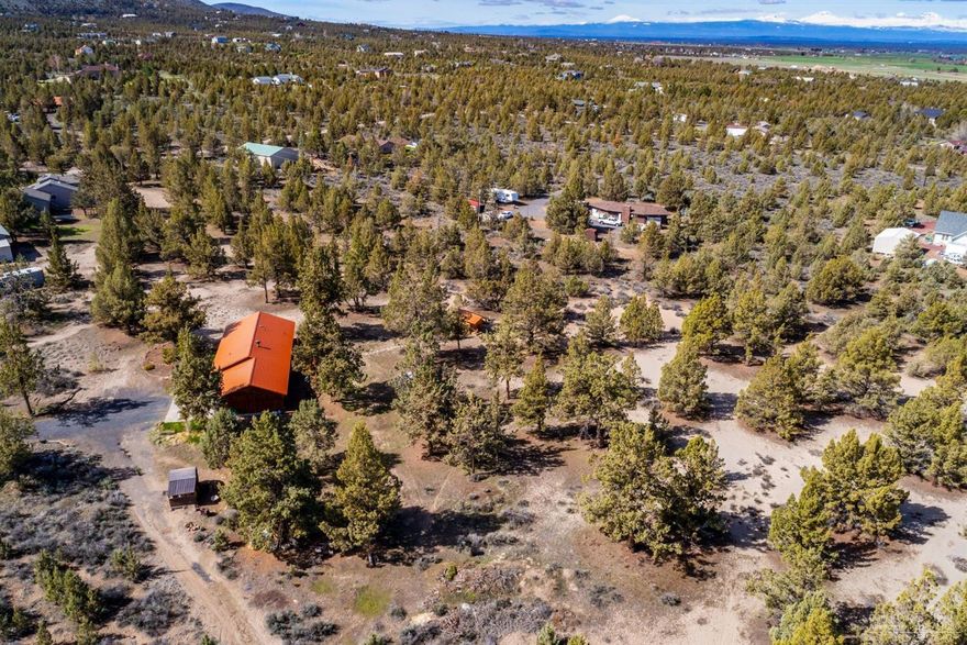 Wonderful parklike setting amongst the Juniper trees on 5 private acres in Powell Butte. Enjoy single level living in this 3 bedroom, 2 bath home with beautiful wood accents in every room, including the exterior of the home. The kitchen and living area look out over back patio and yard where one can enjoy cascade mountain views between the mature landscape. Take advantage of also having a bonus studio, green house and two equipment sheds. Call today for a showing!