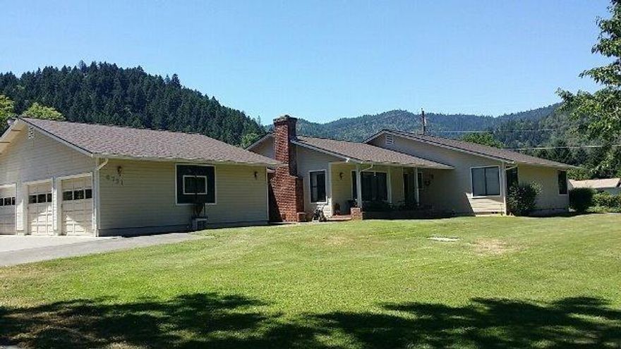 TWO FAMILY SET UP! Live in one and rent the other or have family stay in back home. Two great houses on one tax lot with separate utilities. These homes offer green pastures on 4.92 acres backed up against the mountains. Main house features 3 beds, 2 baths and 2537 sq. ft. This home offers an abundance of custom oak cabinets with plenty of pull out drawers for storage. The formal living room features a wood burning fire place with gas fired log starter. The roof on this home is only 2 years old with an architectural 30 year style shingle. For both homes the well pump system has been replaced 1 year ago. The second house features 2 beds, 2 baths and 1528 sq. ft.. If rented out extra income of $800 a month. Want to go Fishing or Boating? The Rogue River is a hop skip and a jump across the street. Too many extras to list. Opportunity knocks on this one. Don't delay!! All information deemed accurate but not guaranteed and subject to change at any time.