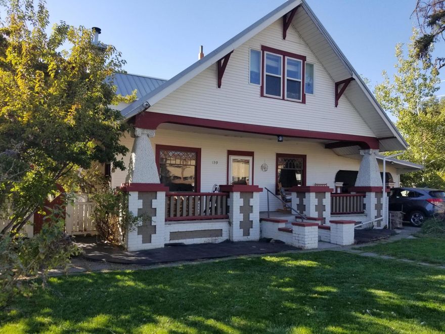 Spacious, Unique, Bungalow style beauty. Built 1917 by C. Scott one of Redmond's first developers. Updated while keeping the character of the era. Original floors and wood work, windows on main, built -ins.Dining room.Carriage house /carport. Old Stables used for storage-shop.Additional W/D plumbing near kitchen. Master on main, Newly carpeted Upstairs. Addition 1980's has 3 bedrooms, full bath and tons of storage. One bedroom could be office space another a huge bonus/flex space.  R3 zone allows for ADU.  Short term rentals. Lots 4,5..Check with Remond City Planning . Sean Cook. Buyer to do  own due diligence. Each lot has separate electric water meters, sewer at street. separate underground sprinklers . Shed/studio has electricity. 
A few Blocks from Downtown Redmond newly developing area with Breweries, Food, carts, restaurants, shopping, medical services Renovated Redmond Hotel. Parks and trails.
Home Warranty provided  by seller including roof.