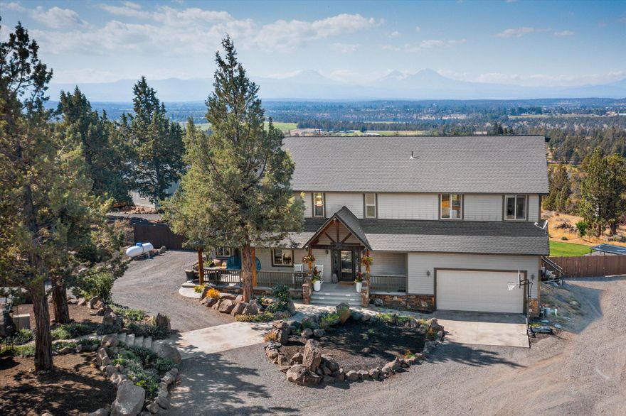 Newly Remodeled. Beautiful Cascade Mountain Views from home on 2.43 acres located Bend and Redmond. Traditional Style home is 3025 sq ft, 3 bedrooms, 4 bathrooms, open floor plan, living room with fireplace, dining area, covered porch and deck access. Large Master suite with fireplace is upstairs with deck. Attached two car garage with workshop space and storage shop area.