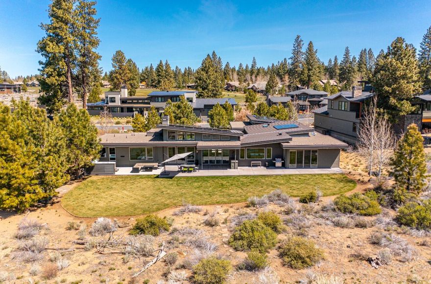 Welcome to the lifestyle you've been dreaming of in this stunning single level contemporary home, designed & constructed w/ timeless features & complete energy efficiency. This quality built Bend Trend home is located right in the heart of it all on the 13th fairway, in the coveted resort community of Tetherow w/ world class trails & wilderness right outside your door. From the moment you walk inside you are welcomed by a fully open floor plan w/ sweeping views of the golf course through the floor to ceiling windows & captivating views of Mt. Bachelor! Floorplan offers nice bedroom & living separation, an expansive gourmet kitchen, triple car garage & tons of built-ins throughout. Owners suite boasts a Japanese soaking tub, tile shower, WIC & private office. This certified Earth Advantage Platinum home was designed to be extremely efficient & full of light. It features 8-inch exterior walls, 14-inch insulated & vaulted ceilings, concrete radiant floor heat & 16kW Tesla Solar Panels.