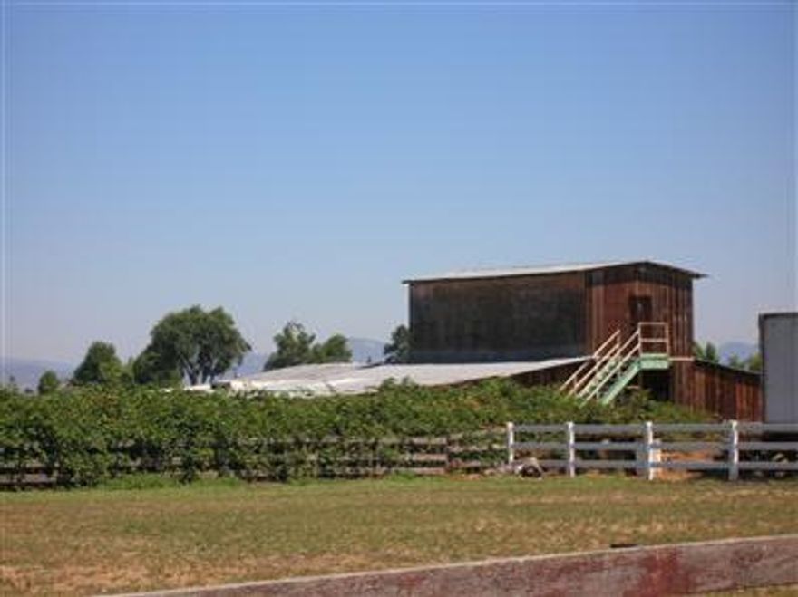 5.2 acres of nice pasture land. Great location with easy access to I-5, Central Point, Jacksonville & Medford. Perfect for 4-H project, horses or livestock. There is a barn on this fully fenced and irrigated parcel. Buyer to perform Due Dilegence in regards to homesite /septic approval. Property begins on Rossanley Dr with a 360 ft x 25 ft wide driveway. This is not an easement, it is part of the property.