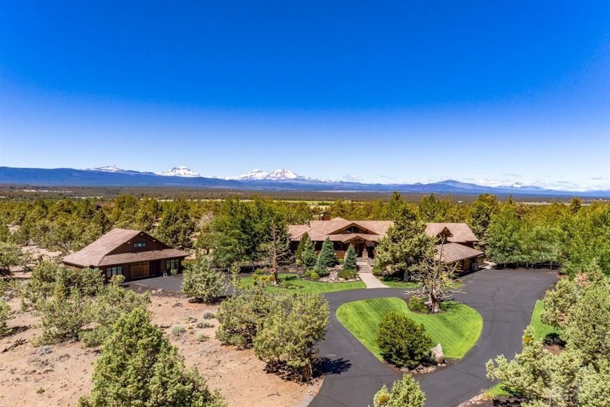 Spectacular Grandridge Estate. This home was Pacwest Builder's Christmas Card backdrop multiple years. Steve Van Sant designed. Brazilian cherry hardwood with copper inlay. Venetian plaster in master bedroom, office and half bath. Double ovens & dishwashers & sub zero fridge in kitchen. Enclosed paver patio deck w/infrared heaters. Wood fireplace in great room. Temp. controlled wine storage in garage. Shop with 976 sq ft of additional living space to include 1 bedroom, 1 bath guest suite with balcony.