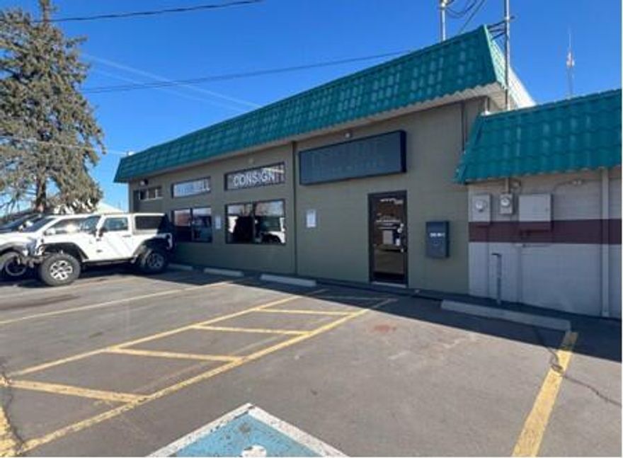 Highly visible location off of the corners of Third Street and Deer Street in downtown Prineville.  Adjacent to True Blue Pet Market and in the 
neighborhood shopping center shared with the Nail Barn, Tan Republic and Express Eco Laundromat. 

14' roll up door off of parking lot.  
High ceilings in both showroom and warehouse areas
Includes two restrooms and office space. 
Additional lightweight storage in mezzanine (not on floorplan). 
Two man doors off of Deer St. to both office and warehouse.
Signage opportunities include both on-building above suite entrance and ½ of the rooftop backlight sign.
Rent includes the exclusive use of the additional alleyway parking. 
Additional parking available on Deer St. 
All other parking is unreserved and in common.
Available immediately. $0.95/SF/MO+NNN