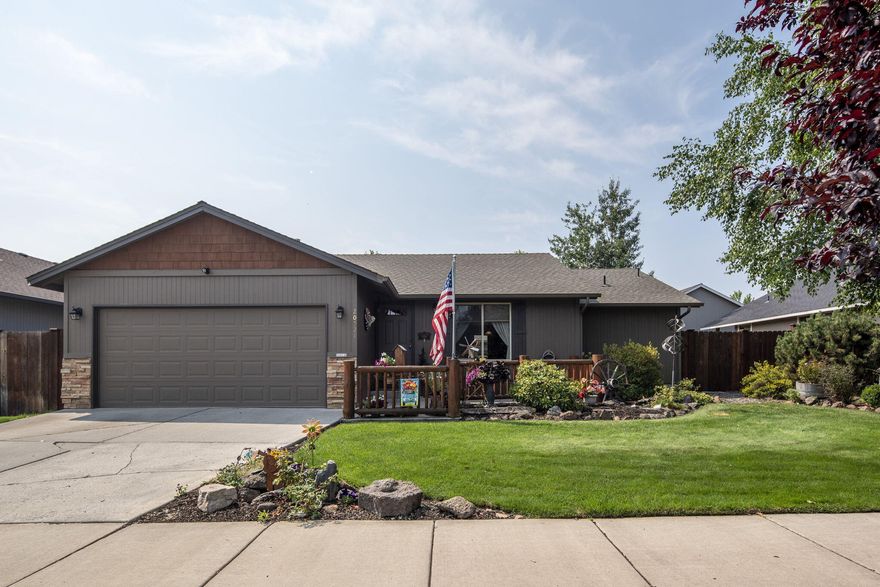 Pride of ownership shows in this single-story home that has numerous updates including a stack rock gas fireplace, newer exterior paint and Central AC. The hardwood flooring in the living area, kitchen and hallway is highlighted in the open floorplan. Kitchen has a breakfast bar and is updated with new counters, fixtures and appliances. The spacious master bedroom has a walk-in closet and ensuite with full walk-in shower that has custom wrap around tile – the bathroom also has a custom tile floor, updated vanity and fixtures. Custom tile floors are also in the utility room and second bathroom, which has a newer vanity and fixtures as well. Both front and backyards are beautifully landscaped and have sprinkler systems. The spacious backyard space has a large deck and mature landscaping for privacy. This property is also conveniently located close to town.