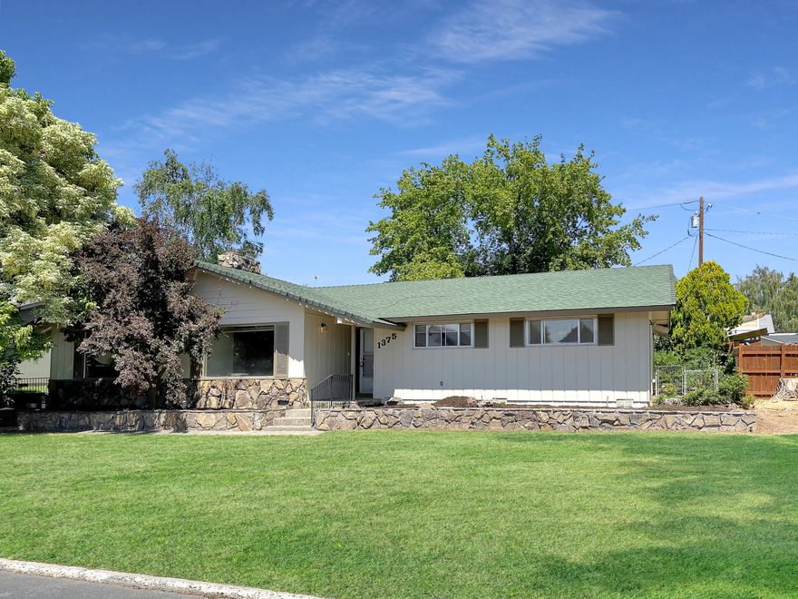 Are you looking for a larger lot in town? RV parking with potential to have an ADU. Welcome to this charming 1970's single level ranch style home located on the NE side of Prineville. This home is almost 2100 sq ft with 3 bedrooms, 2 bathrooms and a huge bonus room with its own entrance and potential to be converted to an ADU. Home has large living room and dining are with oversize laundry room and build in storage throughout. Updated features are Brand New exterior paint, bathroom updates, new carpet and upgraded padding, as well as newer roof and heating system. Home has many original  features that will steal your heart when you walk in! Call today for your private showing. Home Warranty to be included in sale!