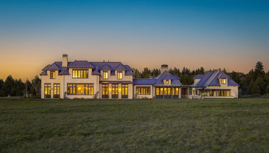 Welcome to the Gist Chateau, where luxury meets tranquility in the picturesque outskirts of Bend, Oregon. Each sunrise and sunset, set to the backdrop of the Cascade Mountains, is a showcased masterpiece at this property. The structures themselves, built in 2010 by RH Construction, are a picture of old-world craftsmanship—ICF construction, custom oak windows and doors, Venetian plaster interiors, and various natural stone finishes, including one grand marble staircase. Spanning 7,744sf and built to highlight the spectacular mountain views, the main home boasts 7 beds and 7.5 baths, while the adjacent 1,275 sf apartment houses 2 beds and 1 bath. With ground water rights to 26 of the 27.4 total acres, it's a paradise for outdoor enthusiasts. Come experience unique, luxury living in Central Oregon at its absolute finest.