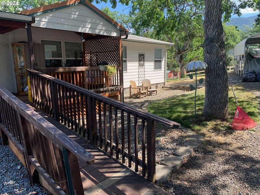 Spacious Manufactured Home on .64 acre lot 2 miles from Emigrant Lake.  Plenty of room for parking large RV, storage sheds and lots of room for entertaining guests. Large kitchen and open floor plan. Dining area with french doors leading to outside deck with views of the mountains. Living room and large family room.