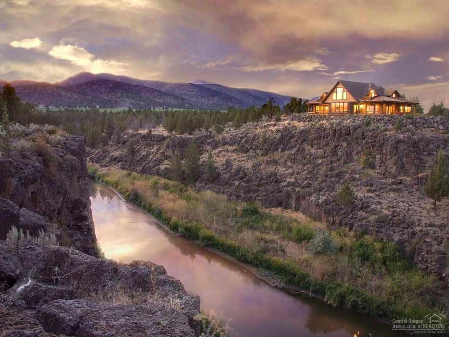 Once in a lifetime, a property comes along that exceeds every expectation. Miles of Crooked River and Cascade Mountain views, in addition to a dream house of high end quality. Main level master & private bedroom suites-all with amazing views. Two more dwellings, within walking distance of the main home, offer compound options or ranch help living quarters. The state of the art barn, roping arena and outbuildings will rival any high performance ranch. If a ranch is in your dreams, then this is your new home.