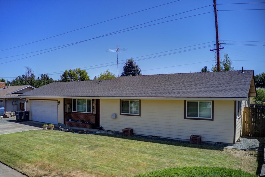 Great home in a quiet neighborhood right next to Scenic Middle School. New gorgeous flooring throughout entry, dining, kitchen, living room and hallway. Kitchen includes beautiful wood counter tops and lots of storage. Pellet stove inside rock fireplace provides lot of heat throughout. Glass slider leads to covered patio with a built in grill great for entertaining. Large backyard with raised garden beds, garden shed with power and gated dog kennel. Automatic In-Ground sprinklers in front and backyard. Attached two car garage with heat and AC along with gated RV parking.